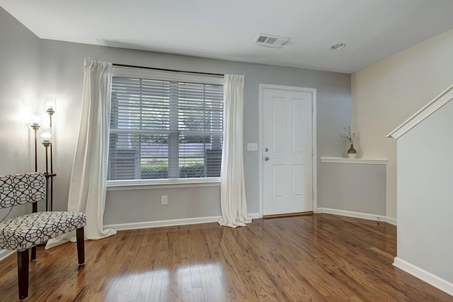 sitting room with hardwood / wood-style flooring