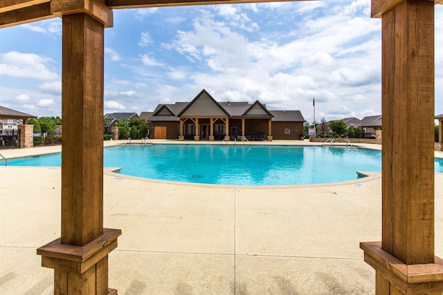 view of swimming pool featuring a patio area