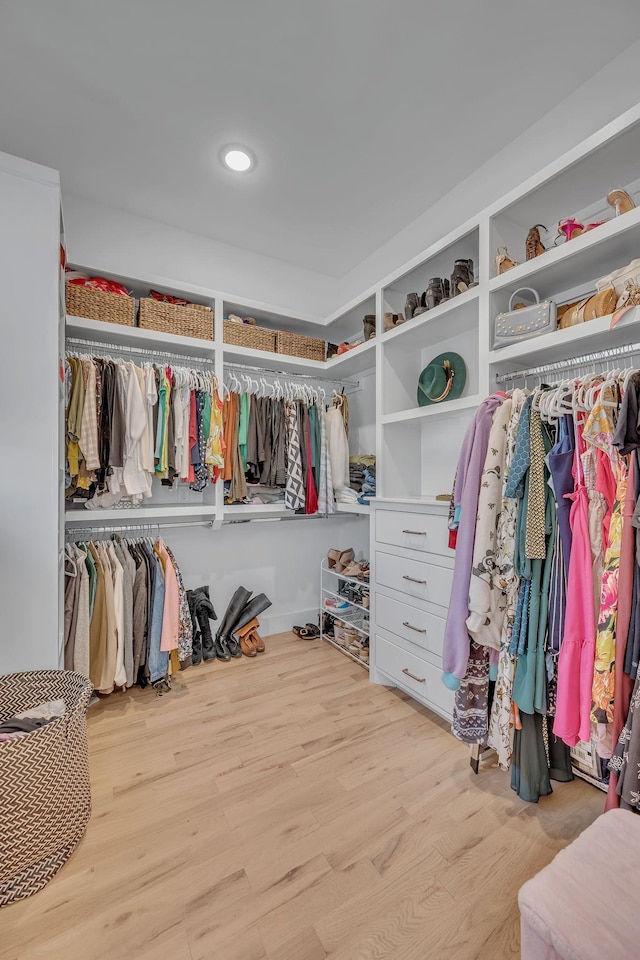 spacious closet featuring light hardwood / wood-style floors