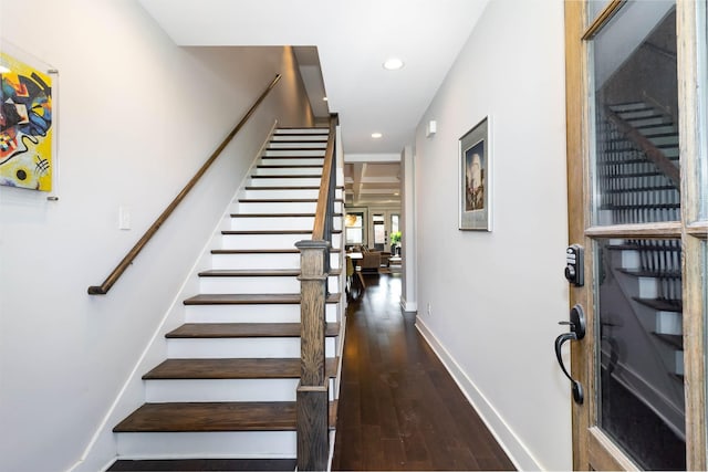 stairs with hardwood / wood-style flooring