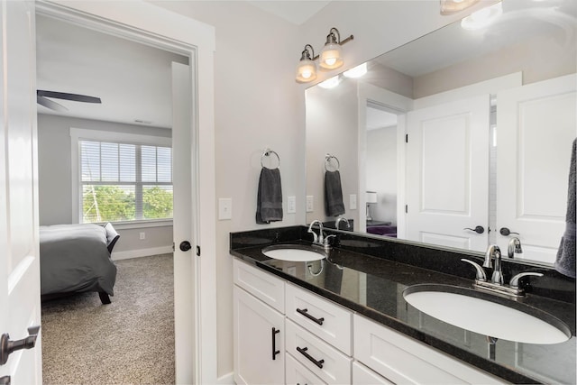 bathroom featuring ceiling fan and vanity