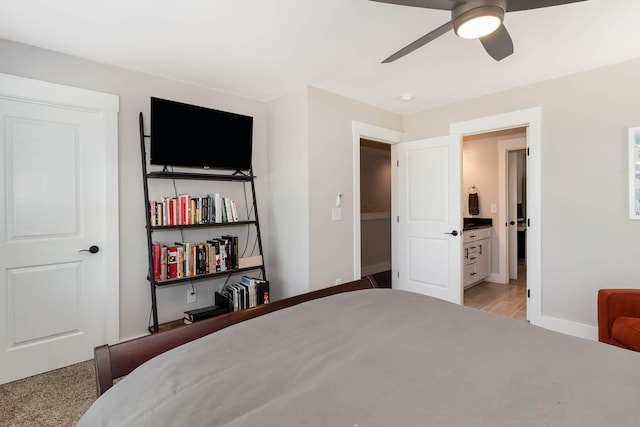 bedroom with connected bathroom and ceiling fan