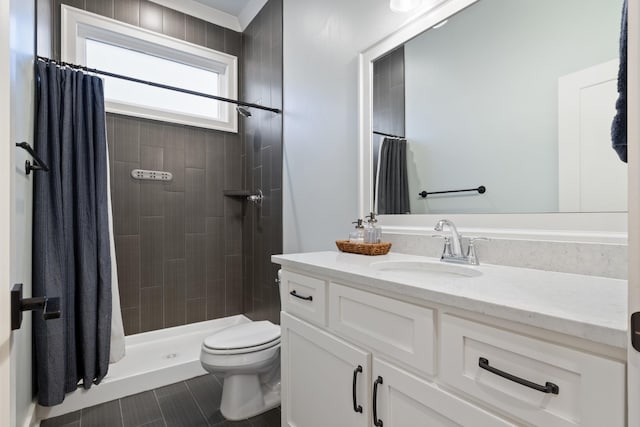 bathroom featuring toilet, vanity, tile patterned flooring, and a shower with shower curtain