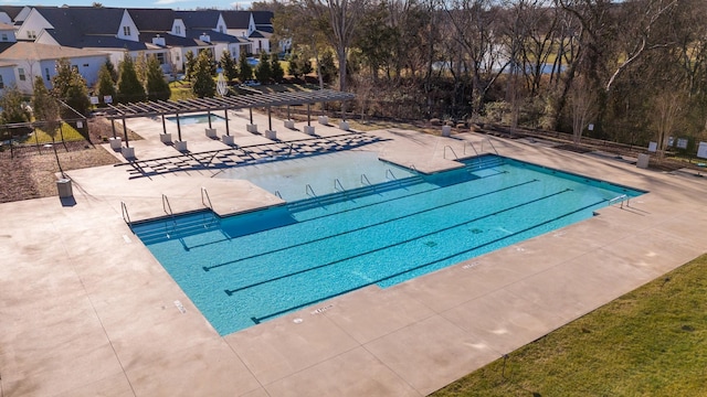 view of swimming pool with a patio