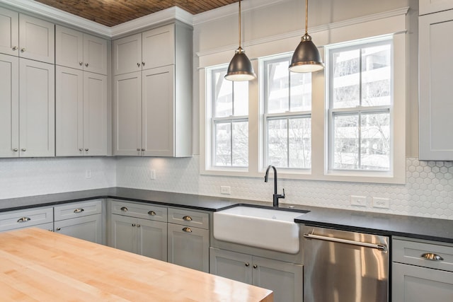 kitchen with wooden counters, gray cabinets, stainless steel dishwasher, and sink