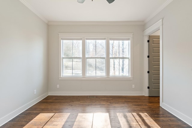 empty room featuring ceiling fan, dark hardwood / wood-style flooring, and crown molding