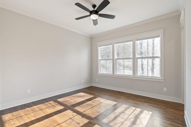 unfurnished room featuring dark hardwood / wood-style flooring, ceiling fan, and ornamental molding