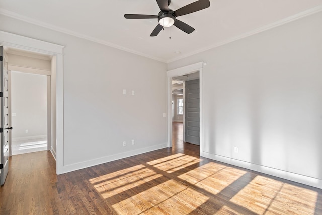 spare room with dark hardwood / wood-style floors, ceiling fan, and ornamental molding