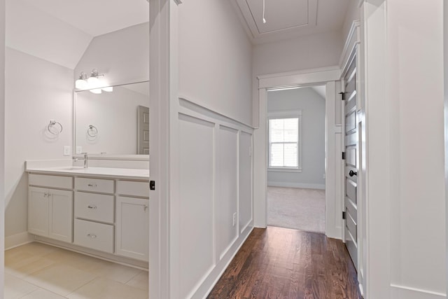 bathroom featuring hardwood / wood-style floors and vanity