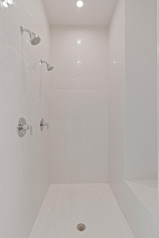 bathroom with a tile shower