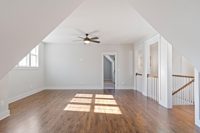 bonus room featuring dark hardwood / wood-style floors and ceiling fan