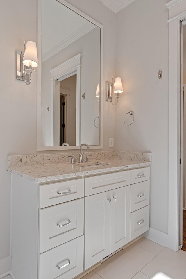 bathroom featuring tile patterned floors, vanity, and ornamental molding