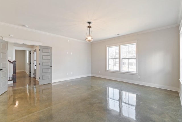 spare room featuring crown molding