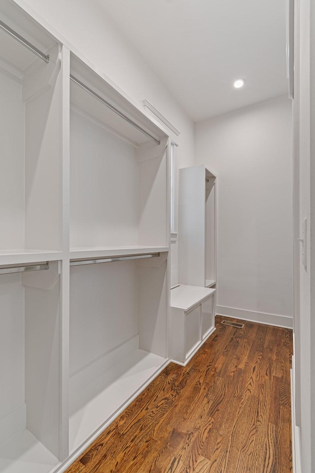 walk in closet featuring dark hardwood / wood-style floors