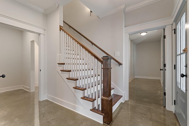 stairs featuring crown molding