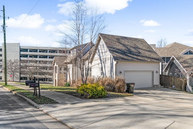 view of side of home featuring a garage