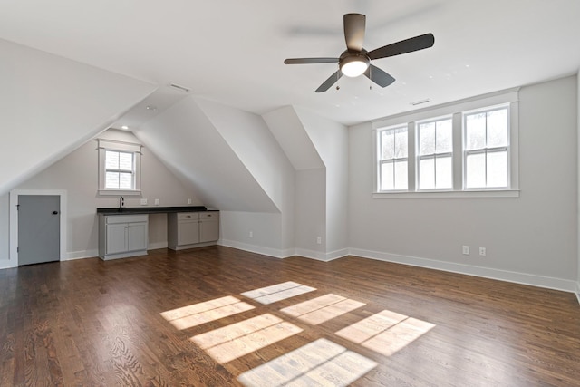 bonus room featuring ceiling fan, dark hardwood / wood-style flooring, and lofted ceiling