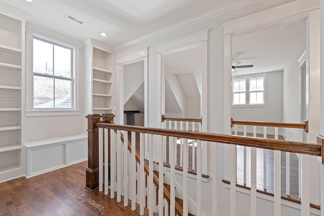 hallway with built in features and dark wood-type flooring