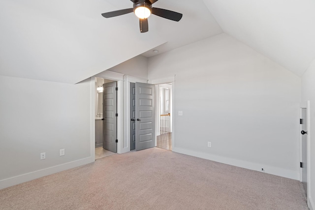 bonus room with ceiling fan, lofted ceiling, and light carpet