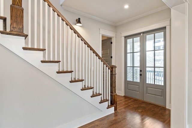 foyer featuring crown molding, french doors, and dark hardwood / wood-style floors