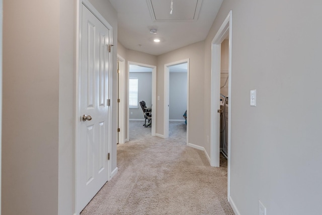 hallway featuring light carpet