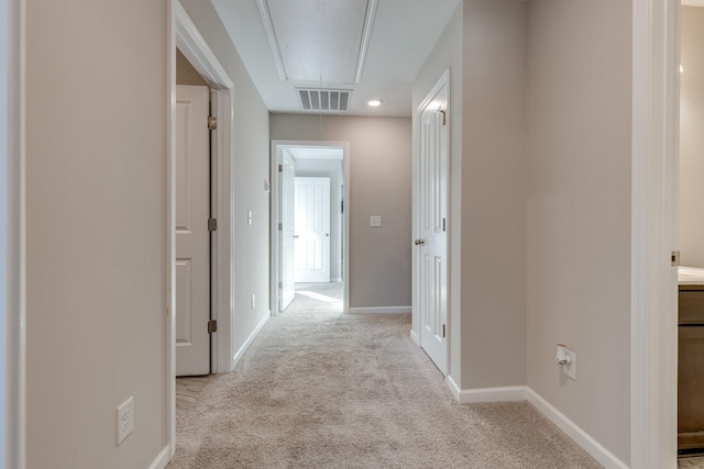 hallway with light carpet