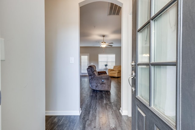 foyer entrance with dark hardwood / wood-style floors and ceiling fan