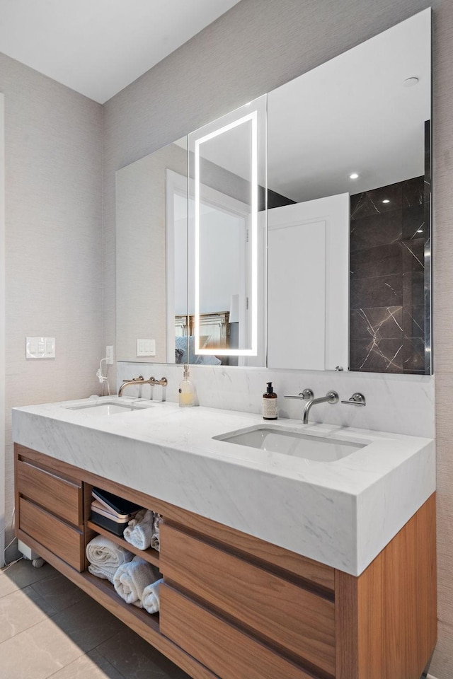 bathroom with tile patterned floors and vanity