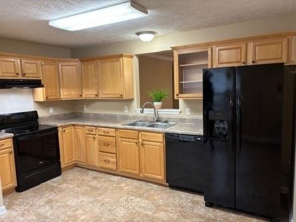 kitchen featuring sink, a textured ceiling, and black appliances