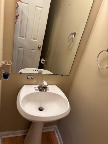 bathroom featuring sink and wood-type flooring