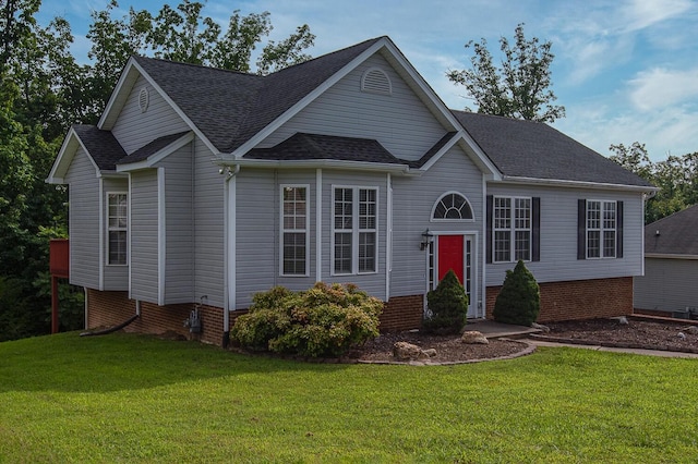 bi-level home with a front lawn