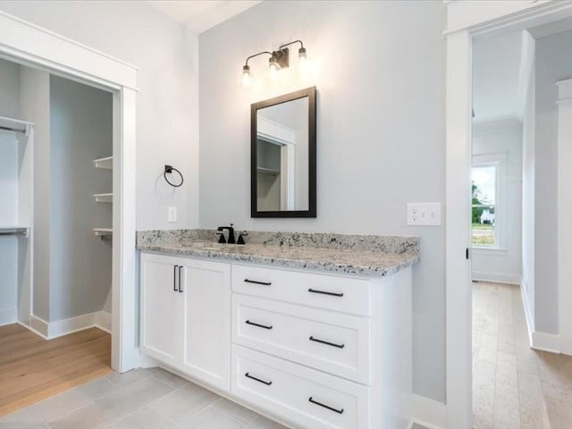 bathroom featuring vanity and hardwood / wood-style flooring