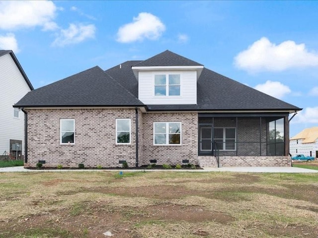 view of property exterior featuring a yard and a sunroom