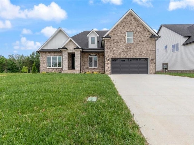 view of front of property featuring a front yard and a garage