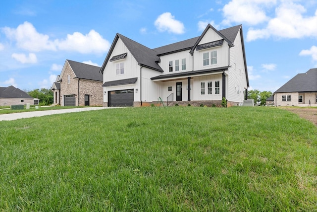 view of front of home featuring a garage and a front lawn