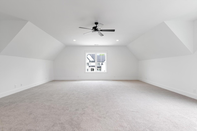 additional living space featuring carpet floors, ceiling fan, and lofted ceiling