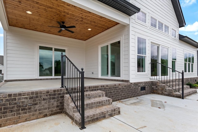 exterior space with ceiling fan