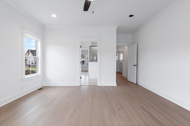 unfurnished living room featuring light hardwood / wood-style flooring, ceiling fan, and crown molding