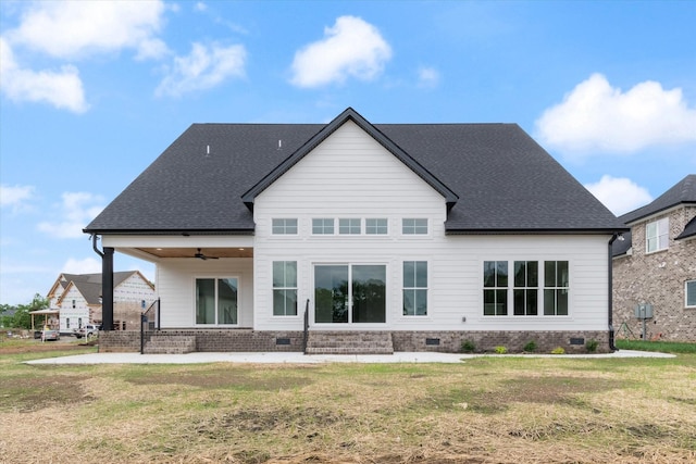 rear view of house featuring a patio, ceiling fan, and a lawn