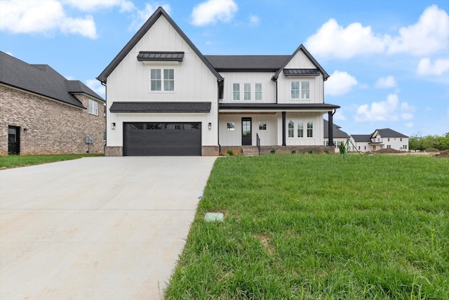 modern farmhouse style home with a garage and a front lawn