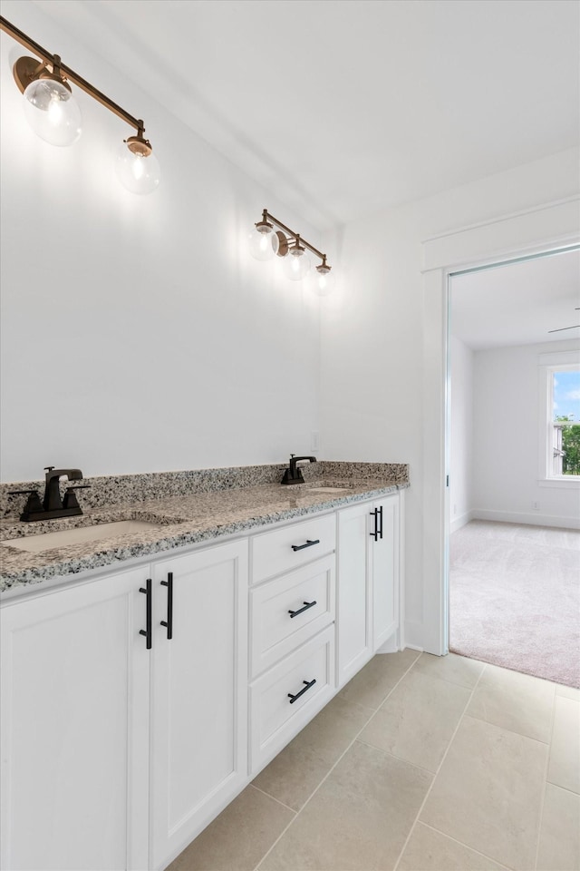 bathroom with tile patterned flooring and vanity