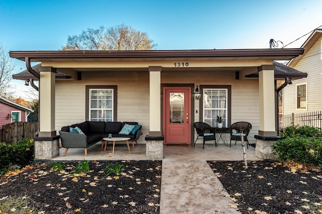 back of property featuring an outdoor living space