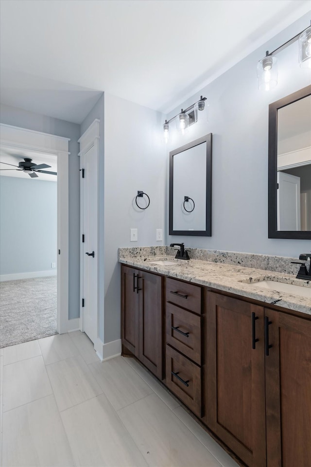 bathroom featuring ceiling fan, tile patterned flooring, and vanity