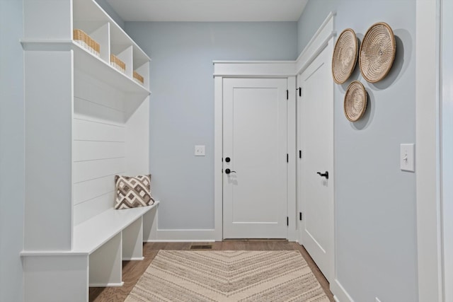 mudroom with wood-type flooring