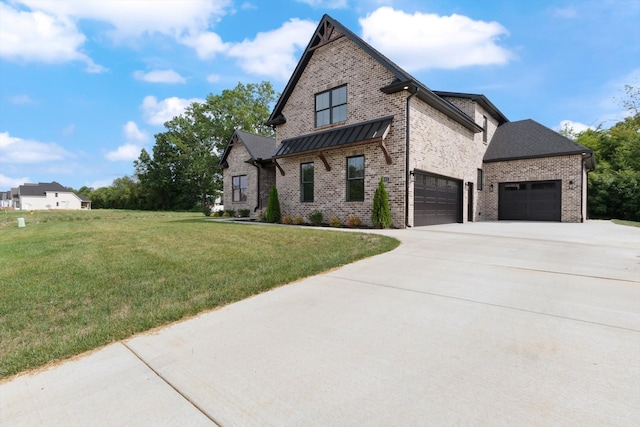 view of front facade featuring a front yard and a garage