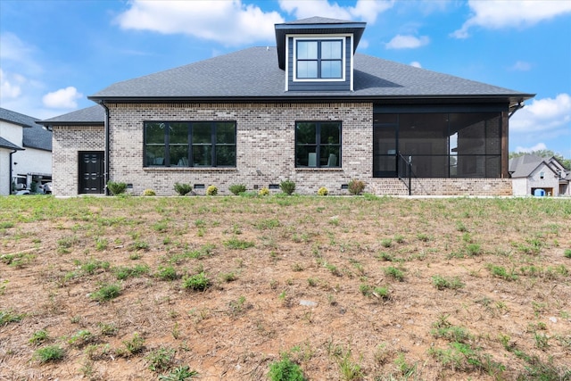 rear view of house with a sunroom