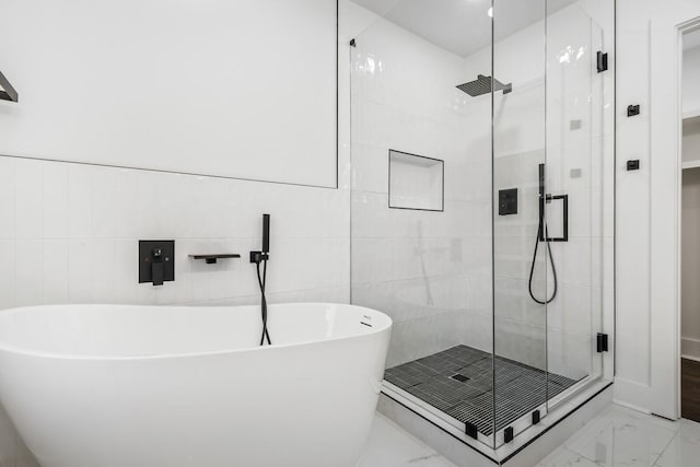 bathroom with shower with separate bathtub and sink