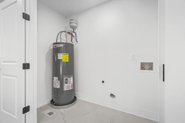 utility room featuring water heater