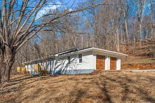 view of property exterior featuring a garage