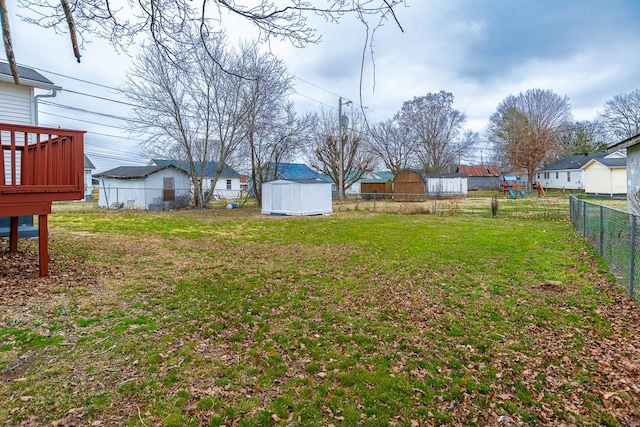 view of yard featuring a storage unit